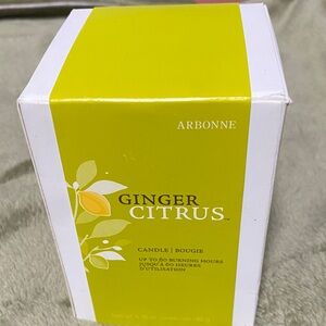Arbonne Ginger Citrus Candle in Vibrant Yellow